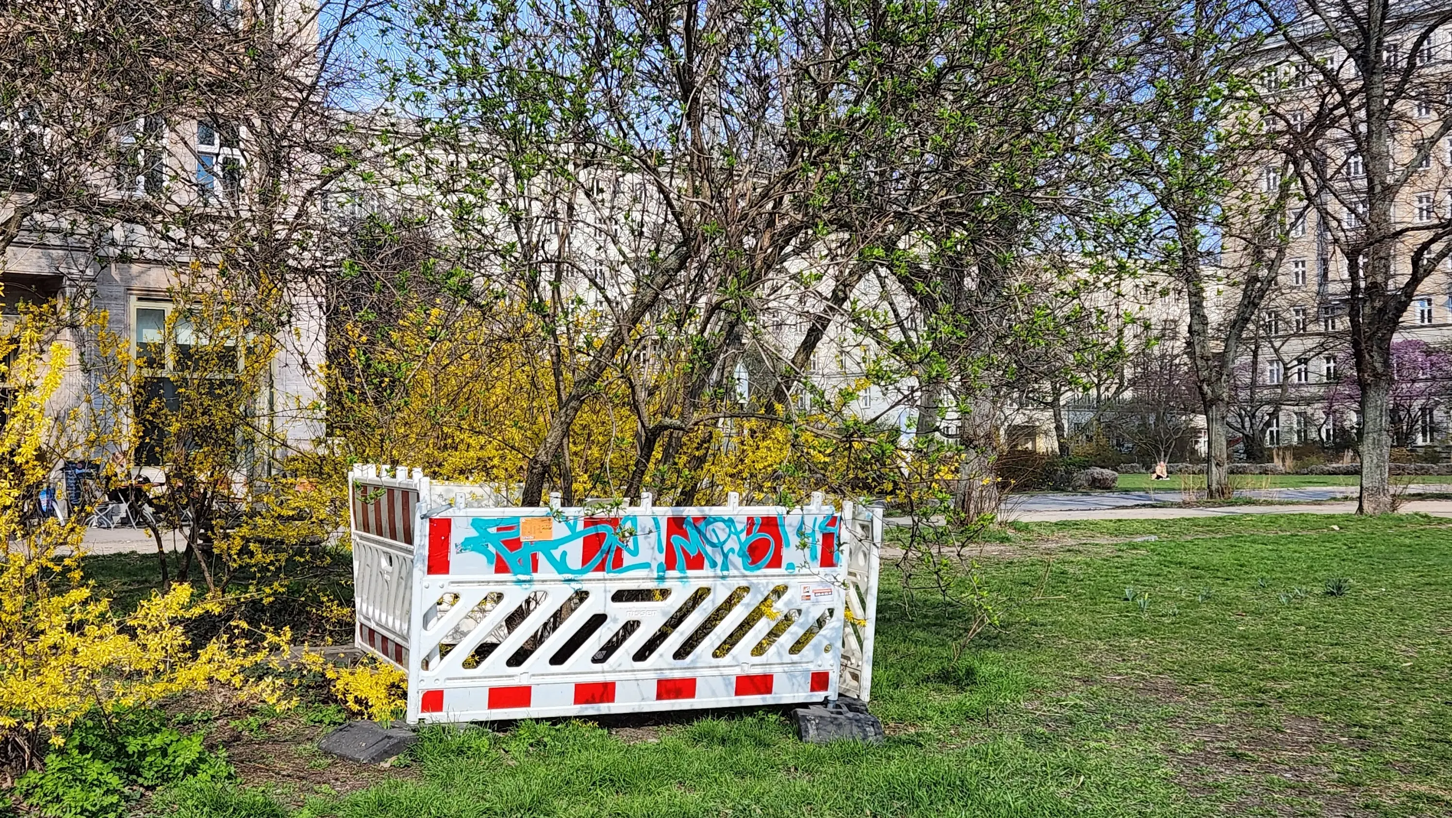 Construction barrier photographed as if it were an exhibit in Walls of Berlin.